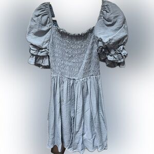 Smocked blue dress with puff sleeves